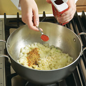 Add garlic, gingerroot, and spices to onion and sauté briefly to bring out the flavors of the spices.