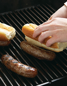 Once the brats are cooked, place the buns on top for a few minutes to warm through and toast slightly.
