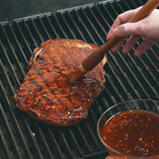 Grill steak on one side, then flip and glaze. Don&rsquo;t glaze before this point or the sauce could burn.