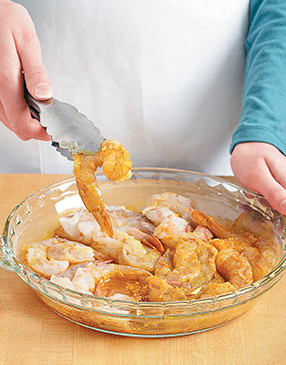 A shallow dish like a pie plate works great for marinating shrimp. Be sure to fully coat them in the marinade.