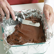 To ensure even thickness, spread the fudge to the edges of the pan with an offset spatula or the back of a spoon.