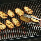 Grill slices of bread on both sides until toasted. Watch carefully to avoid burning the bread.