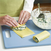 Blot the lasagna sheets dry with a paper towel, then fill with 1/3 cup of filling. Roll each filled sheet into a cylinder.