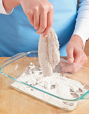 For a light crust on the fish, you just need a scant coating of flour. When dredging, shake off any excess.  