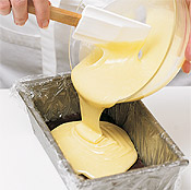 Line a loaf pan with plastic wrap, leaving an overhang on both ends to lift the ganache out.