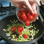 Add tomatoes to softened leeks and cook until tomatoes begin to break down and turn juicy.