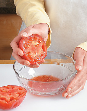 Gently squeeze the tomato over a bowl to remove the seeds and to eliminate some of the excess liquid.