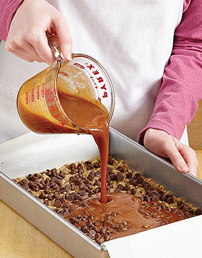 Pour caramel over the mixture to create a firm chewy layer.