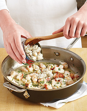 Pasteurized crabmeat doesn't need to be saut&eacute;ed before roasting, so just gently fold it in off heat.