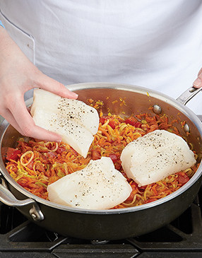 Place cod fillets on top of sauce. The sauce protects the bottom of the fish while it steams.
