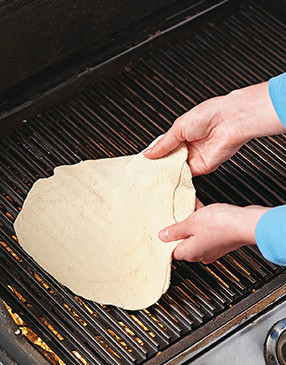 The high, direct heat from the fire penetrates the crust and helps firm it up quickly.