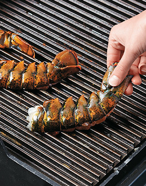 Be sure to place the tails on the grill flesh side down. Flip tails onto the shell to finish cooking.