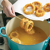 Use a skewer to add and remove rings from oil. Drain fried onion rings on a paper-towel-lined plate.