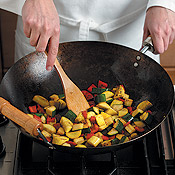 Stir often to keep the vegetables moving in the wok. This ensures they&acute;ll cook quickly and evenly.