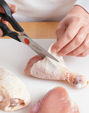 Use kitchen shears to cut through chicken skin. Paper towels work well for pulling off the skin.