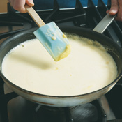 Heat egg mixture over medium heat just until curds start to form on a spatula when mixture is stirred.  