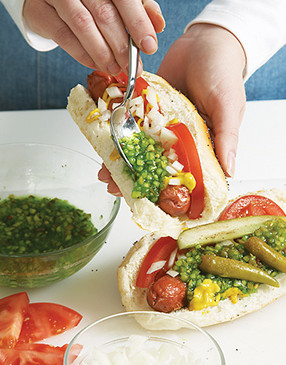 Load the grilled dogs with toppings. To make traditional bright green relish, tint it with food color.