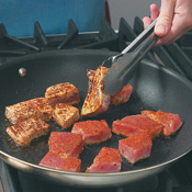 For optimal color and flavor, pan-sear the tuna in a really hot skillet. The marinade will caramelize on the edges for extra flavor.  