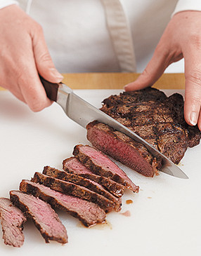 Cut the steak into thin slices against the grain to make it easier to build and eat the sandwich.
