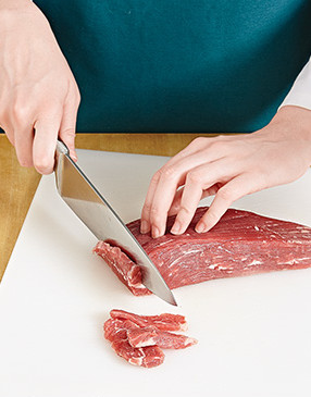 Thinly slice the flank steak against the grain so it cooks quickly and doesn’t become tough.