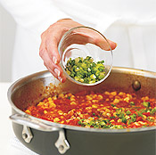 Remove sauce from heat before adding scallions to retain the vegetable's color and crunch.