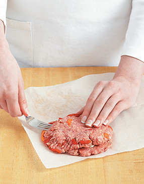 Press the edges of the two patties together with a fork to form one cheese-stuffed burger.