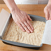 Press the shortbread mixture into an even layer in a pan lined with parchment paper.
