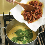Finish soup with spinach, a splash of brandy, and sausage; simmer just until spinach wilts.