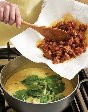 Finish soup with spinach, a splash of brandy, and sausage; simmer just until spinach wilts.