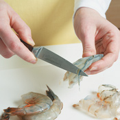 To devein shrimp, slice along the back to expose the vein; remove with the tip of a knife.
