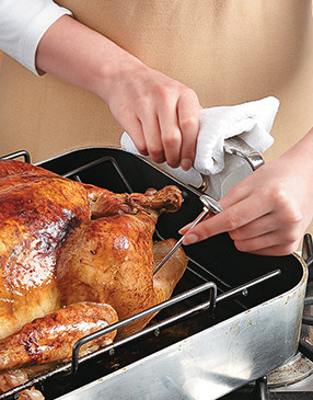 The turkey is fully cooked when the thickest part of the thigh and breast registers 165°.