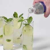 After straining rum mixture into glasses, add ice and 4&ndash;6 ounces of club soda to each glass. 