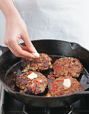 Place a pat of butter on each burger after flipping them. The butter will melt and add delicious flavor.