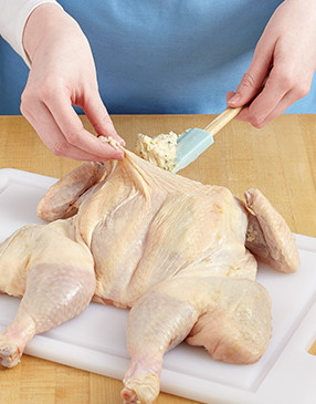 Put butter under the skin of the breast, then massage the outside of the breast to spread the butter.