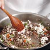 Stir in the flour; cook 1 minute to remove the raw taste and to coat the meat and vegetables.