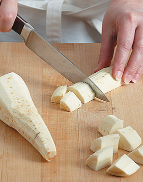 Parsnips look like white carrots. Peel them like a carrot, then cube them to cook with the potatoes.