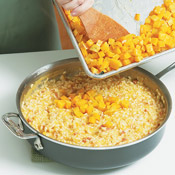 Remove the risotto from the heat. Stir in the reserved roasted squash, along with the fontina and herbs.