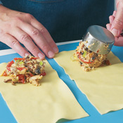 Pat the pasta dry and measure 1/4 cup filling onto each sheet. Don't overfill or it will squish out the sides.

