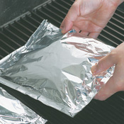 Place packets on grill set at medium heat; cover and cook 12&ndash;15 minutes. Packets will puff from the steam inside.