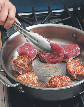 The trick to well-seared medallions is to resist moving them. They'll release when a crust has formed.