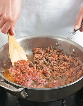 Brown the meat in a large pan, then add the vegetables &mdash; they'll soak up the flavor from the drippings.