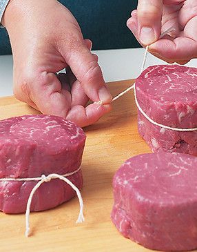 Tie the filets with kitchen twine secured with a double knot to help them hold their shape as they cook.