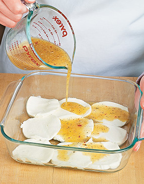 To marinate mozzarella, completely cover it in dressing, then let stand until ready to use.