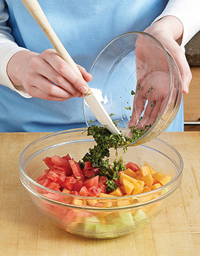 Gently toss the melon with the herb mixture so the fruit doesn't break down too much.
