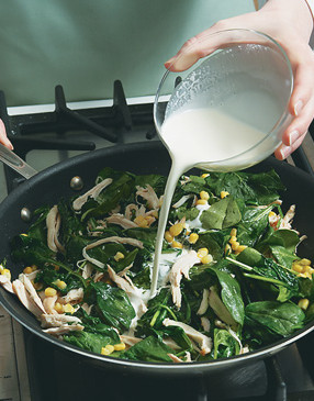 Saut&eacute; spinach, add chicken and corn, then stir in cream and cheese. Simmer to thicken.