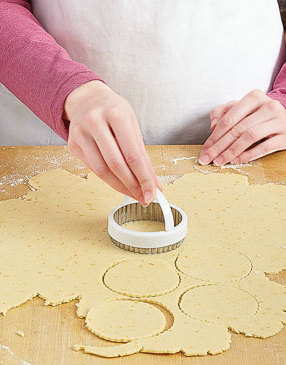 Roll one dough disk at a time to 1/8-inch thick. Cut rolled out dough into rounds with a 3-inch cutter.