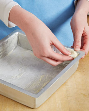 For easier removal of the bars, coat the entire inside of the baking pan (sides and corners) with butter.