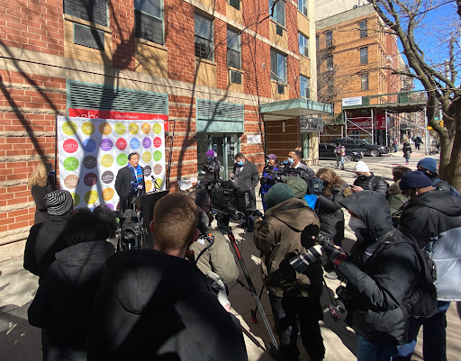 Andrew speaks to press in Harlem