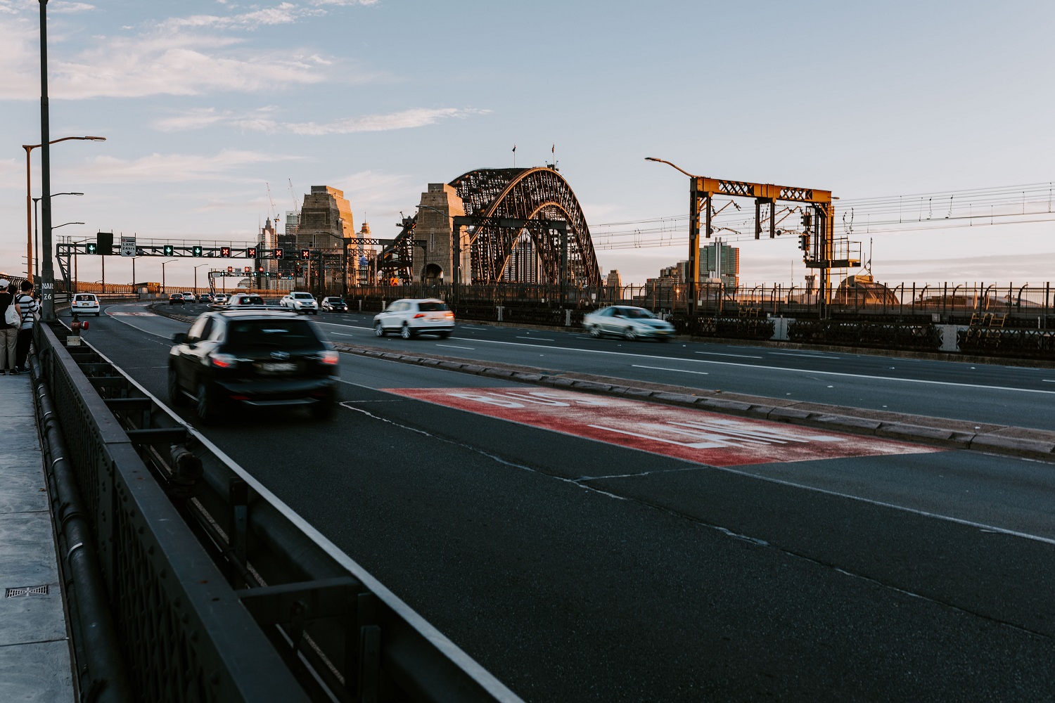 Cars driving over Sydney harbour bridge