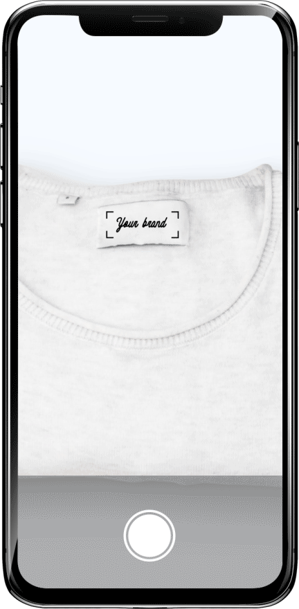 Smartphone taking photo of tag on shirt